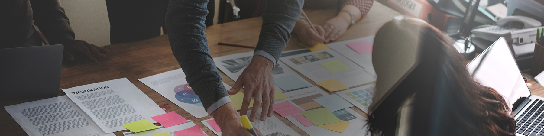 image of office staff working at a desk